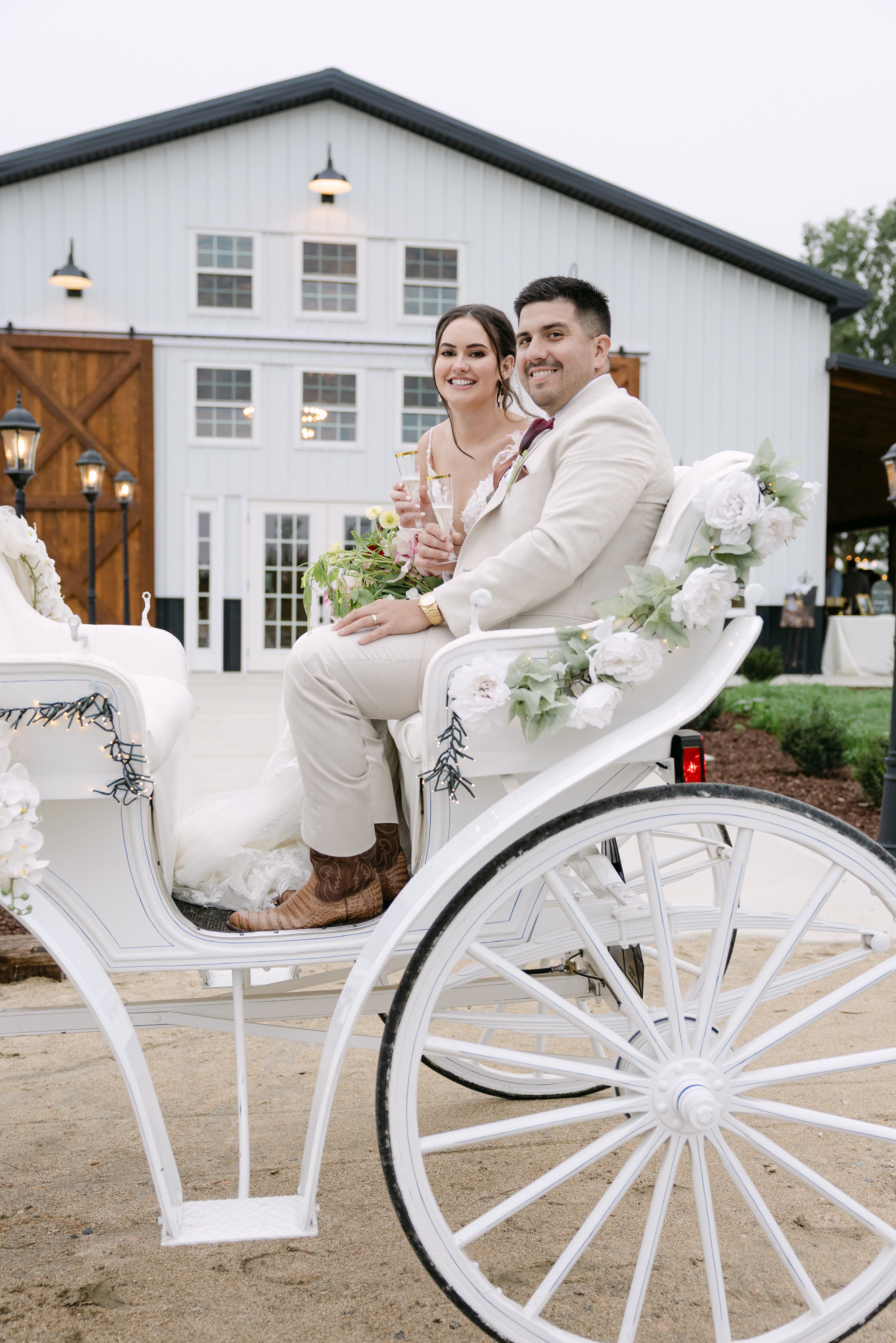 Couple with carriage at barn