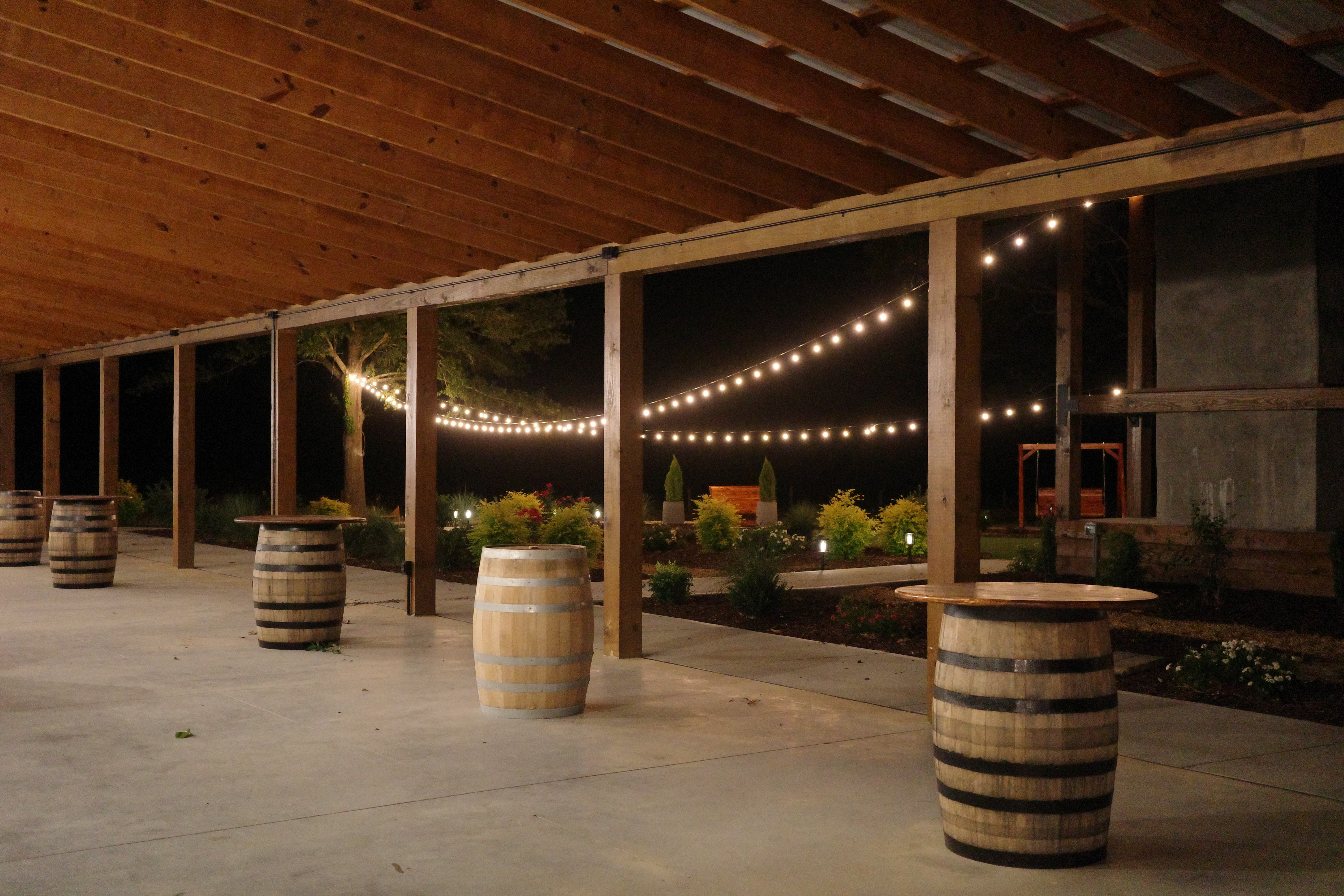 Barrel cocktail tables at night